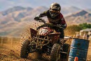 ATV rider kicking up dust